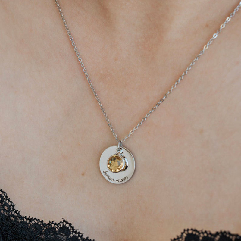 Amira Necklace — a personalized piece featuring a birthstone pendant and custom engraving