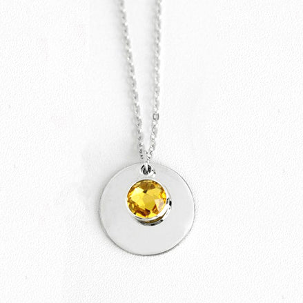 Amira Necklace — a personalized piece featuring a birthstone pendant and custom engraving